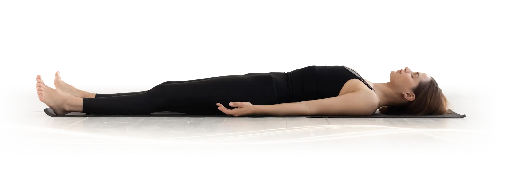 Person resting, fully visible, on a Beamer PEMF mat